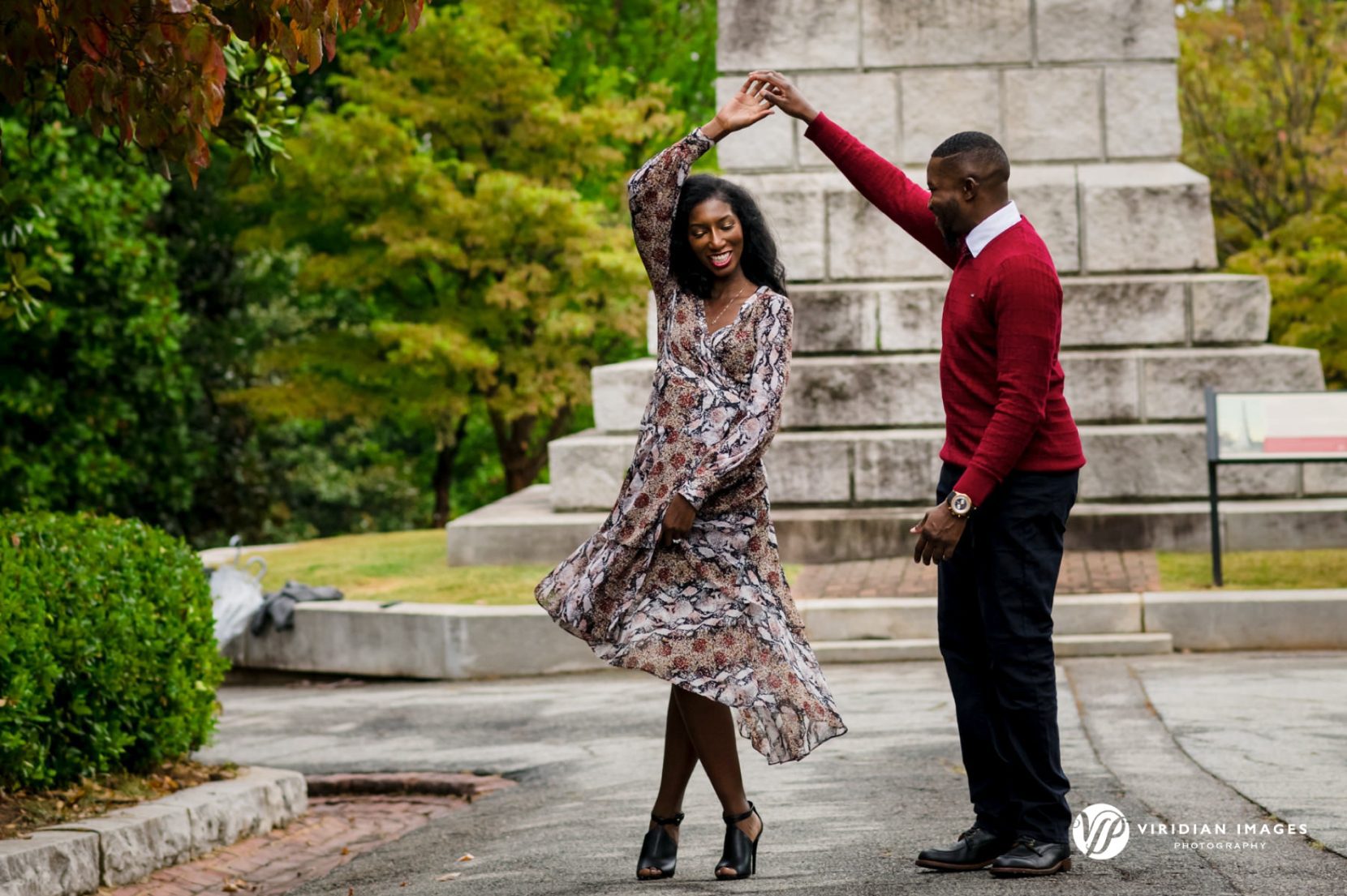 Engagement photos of couple walking at Oakland Cemetery Atlanta