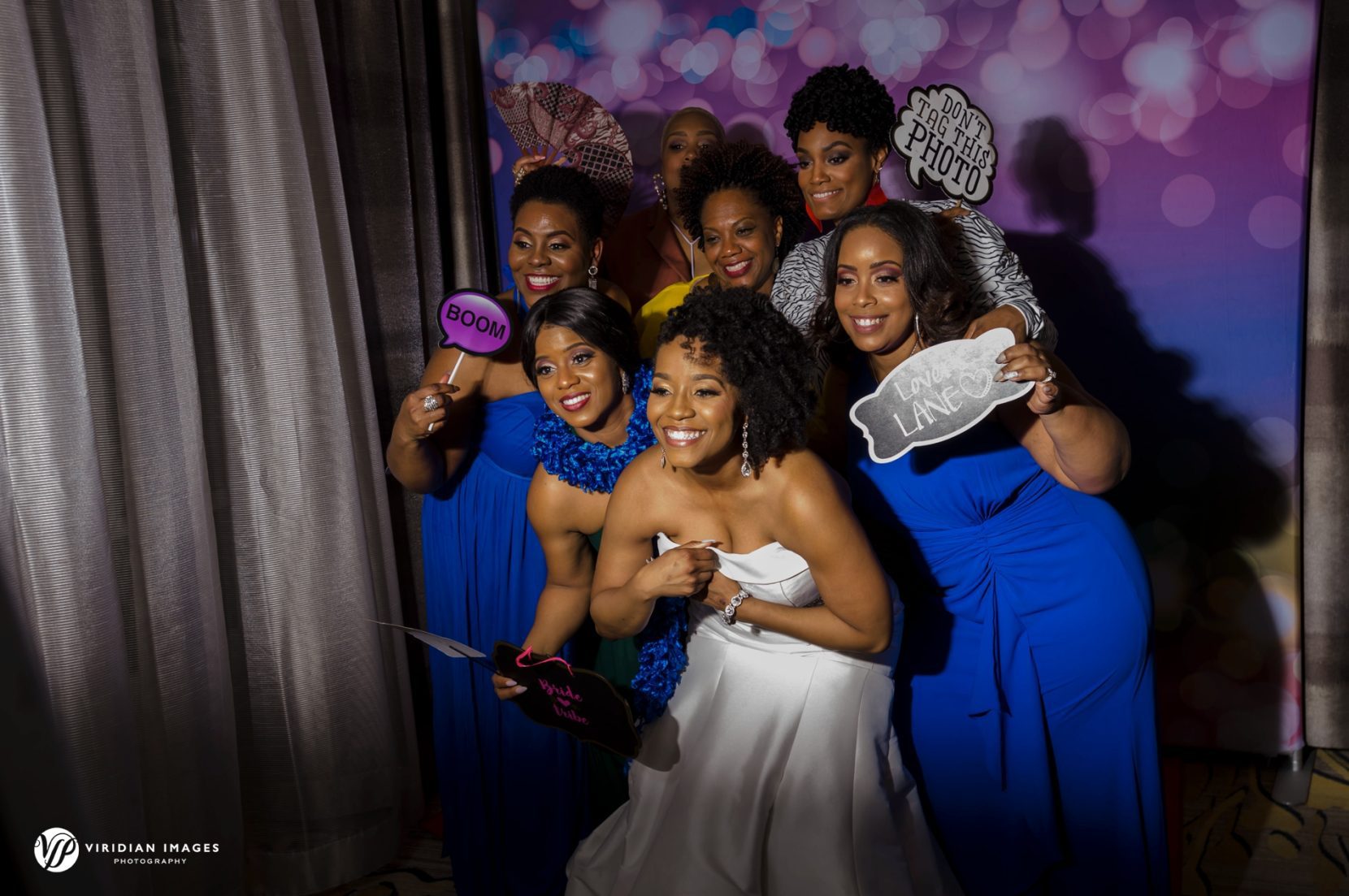 Bride and friends pose at photo booth in Villa Christina Hyatt Regency Atlanta Perimeter