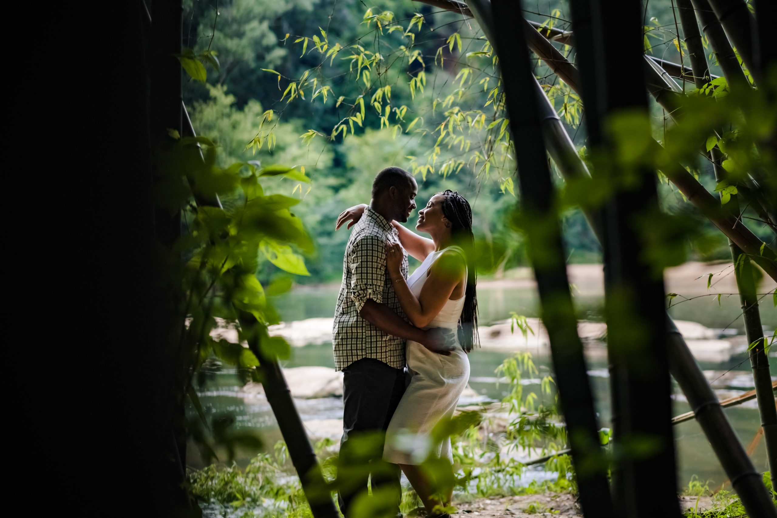 Couple wrapped in each other's arms among the towering bamboo at East Palisades Trail along Chattahoochee River