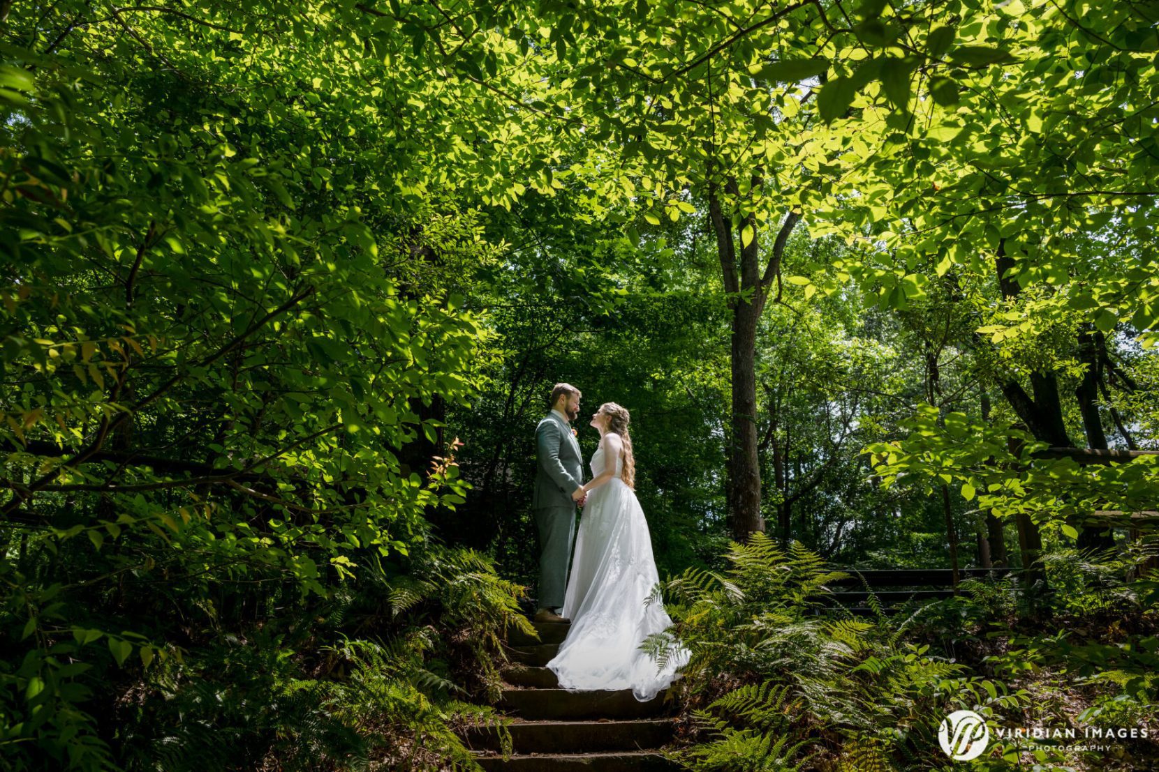 Bride and groom romantic wedding portrait in nature at Dunwoody Nature Center luxury wedding photographer