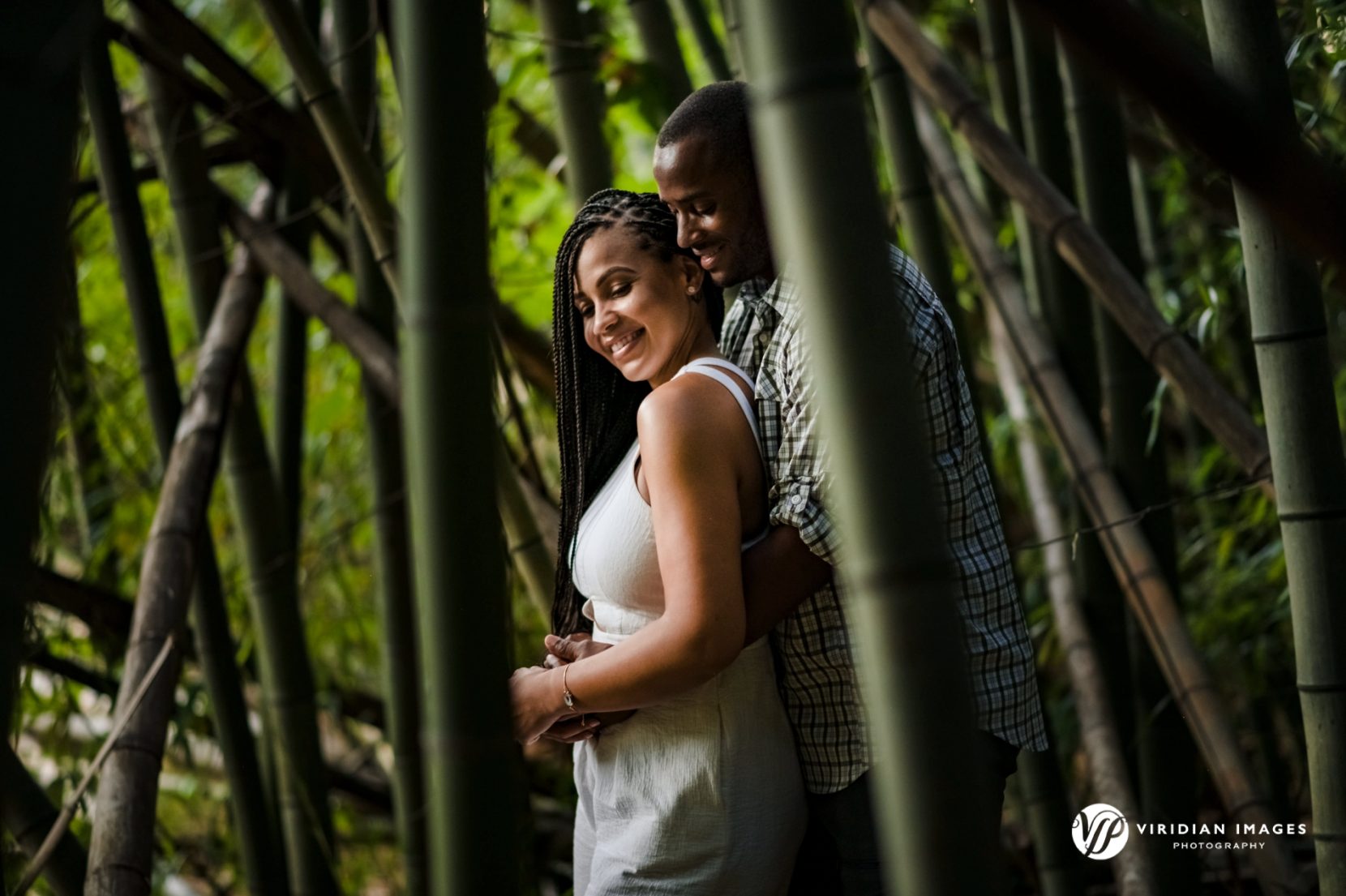 Couple wrapped in each other's arms among towering bamboo at East Palisades Trail along Chattahoochee River