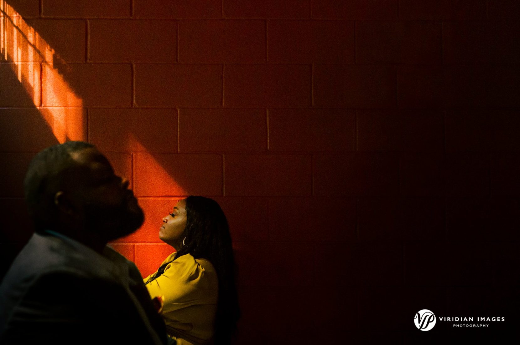 Creative use of light against bold red colored wall in parking garage in midtown Atlanta