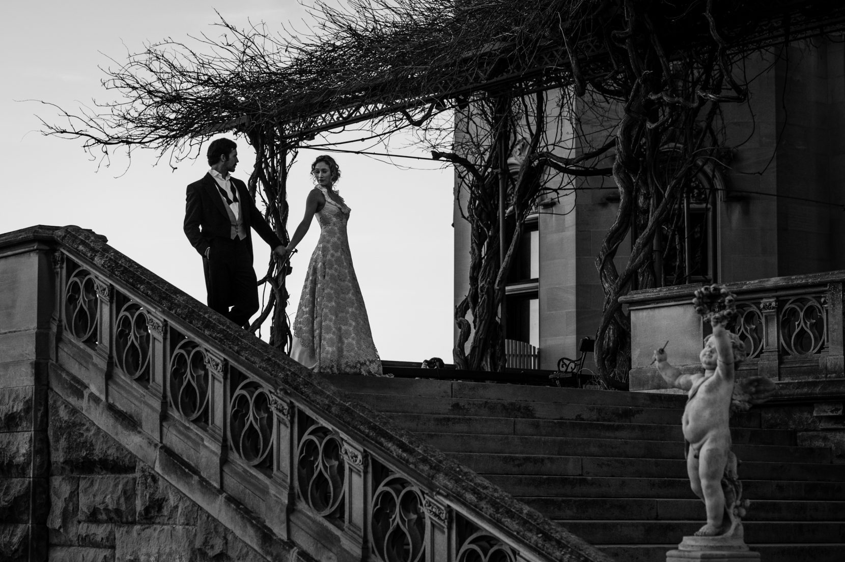 Bride and Groom portrait on top of the Biltmore Asheville outdoor terrace at sunset timeless wedding photography