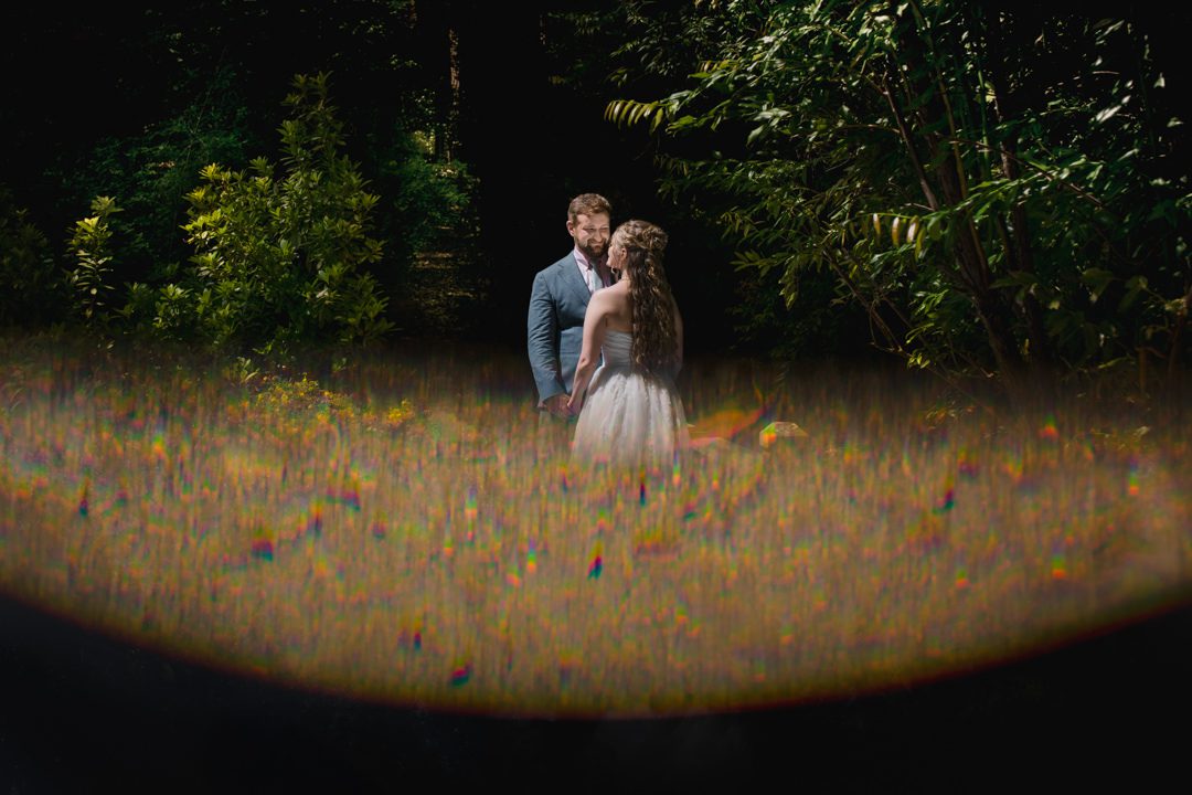 Bride and groom sharing an emotional first look, captured in a candid yet editorial style by Viridian Images Photography