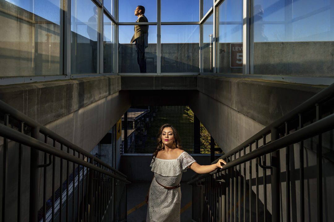 Bride and groom posed under creative flash lighting for a cinematic editorial engagement session in downtown Atlanta.