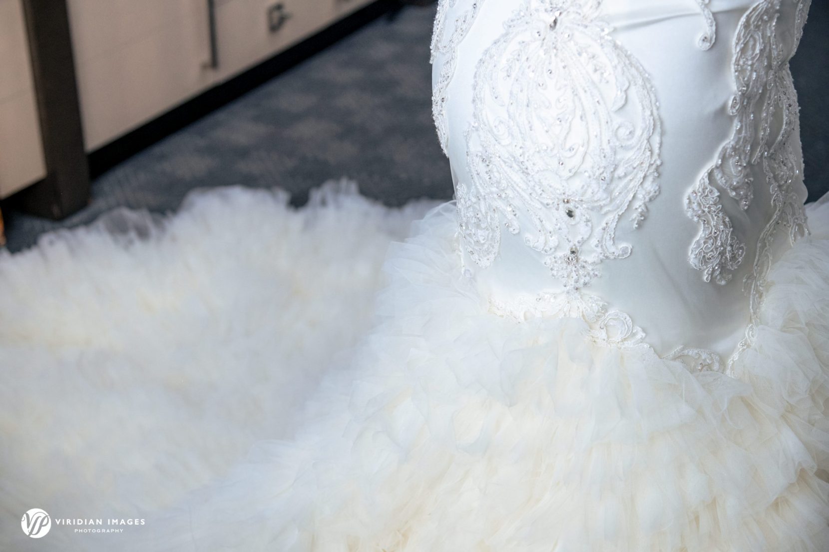 wedding dress ruffle detail on bride purchased at Winnie Couture