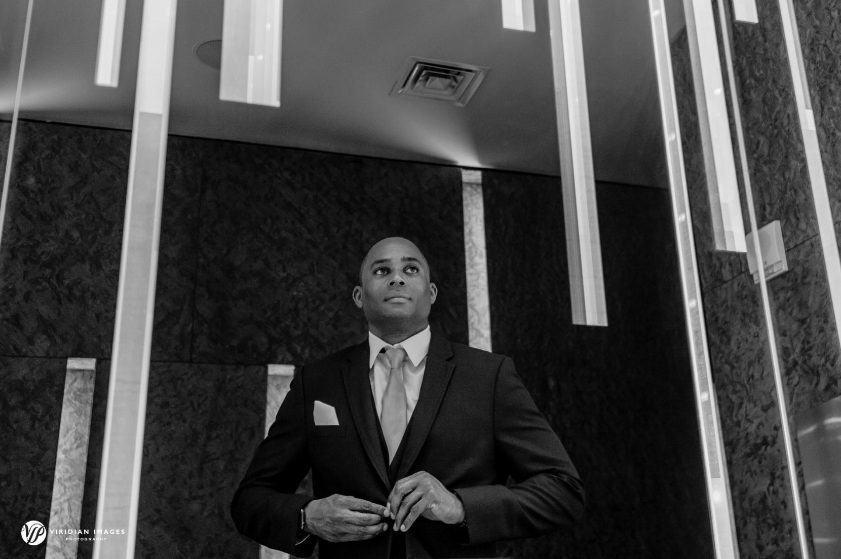 groom reflection in bathroom mirror at W hotel Atlanta