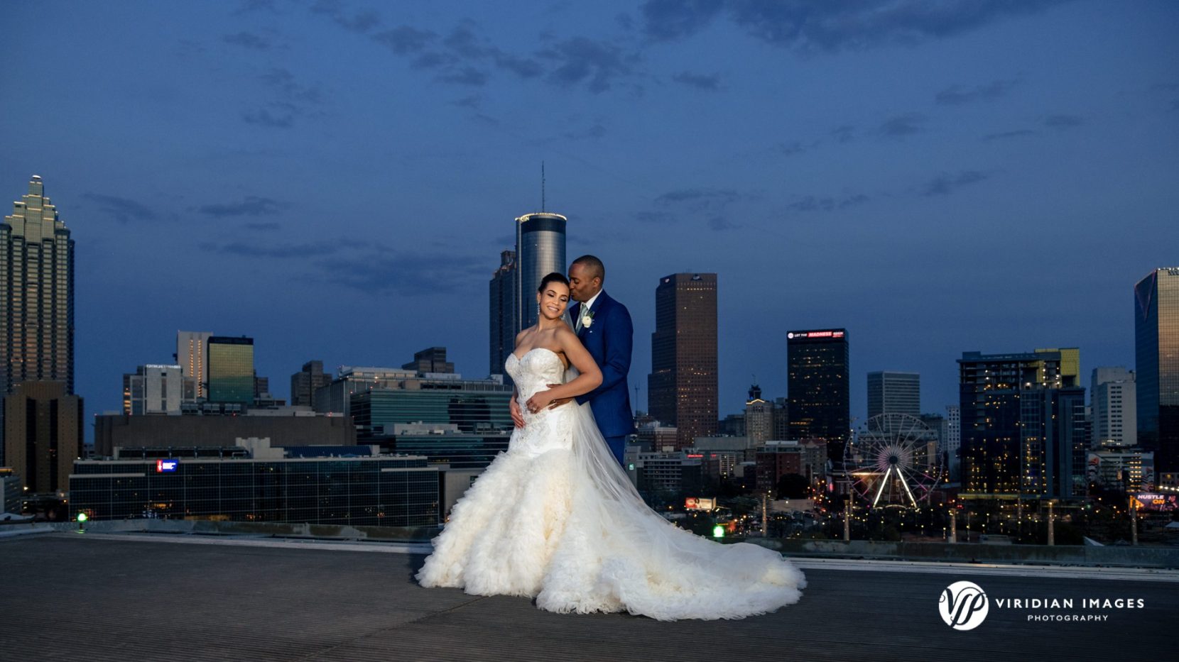 Wedding portrait against blue hour and Atlanta city skyline
