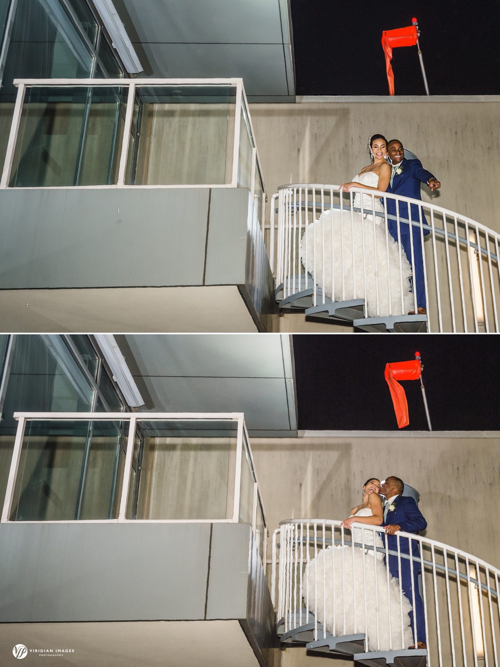 Bride and groom climbing spiral stairs up to helipad at end of the night