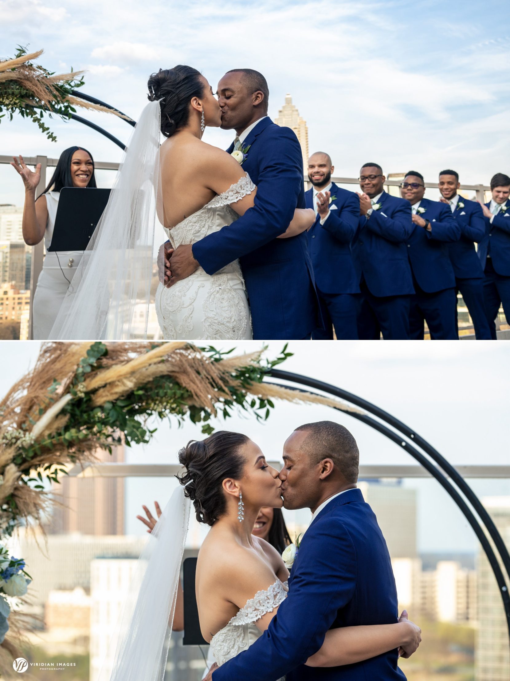 bride and groom first kiss against city skyline on top of Ventanas Atlanta terrace