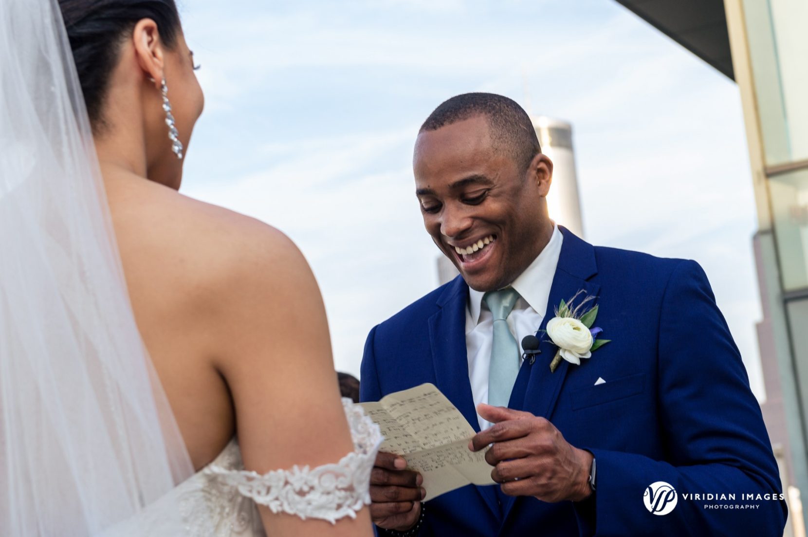 groom laughs during vow exchange at Ventanas Atlanta wedding