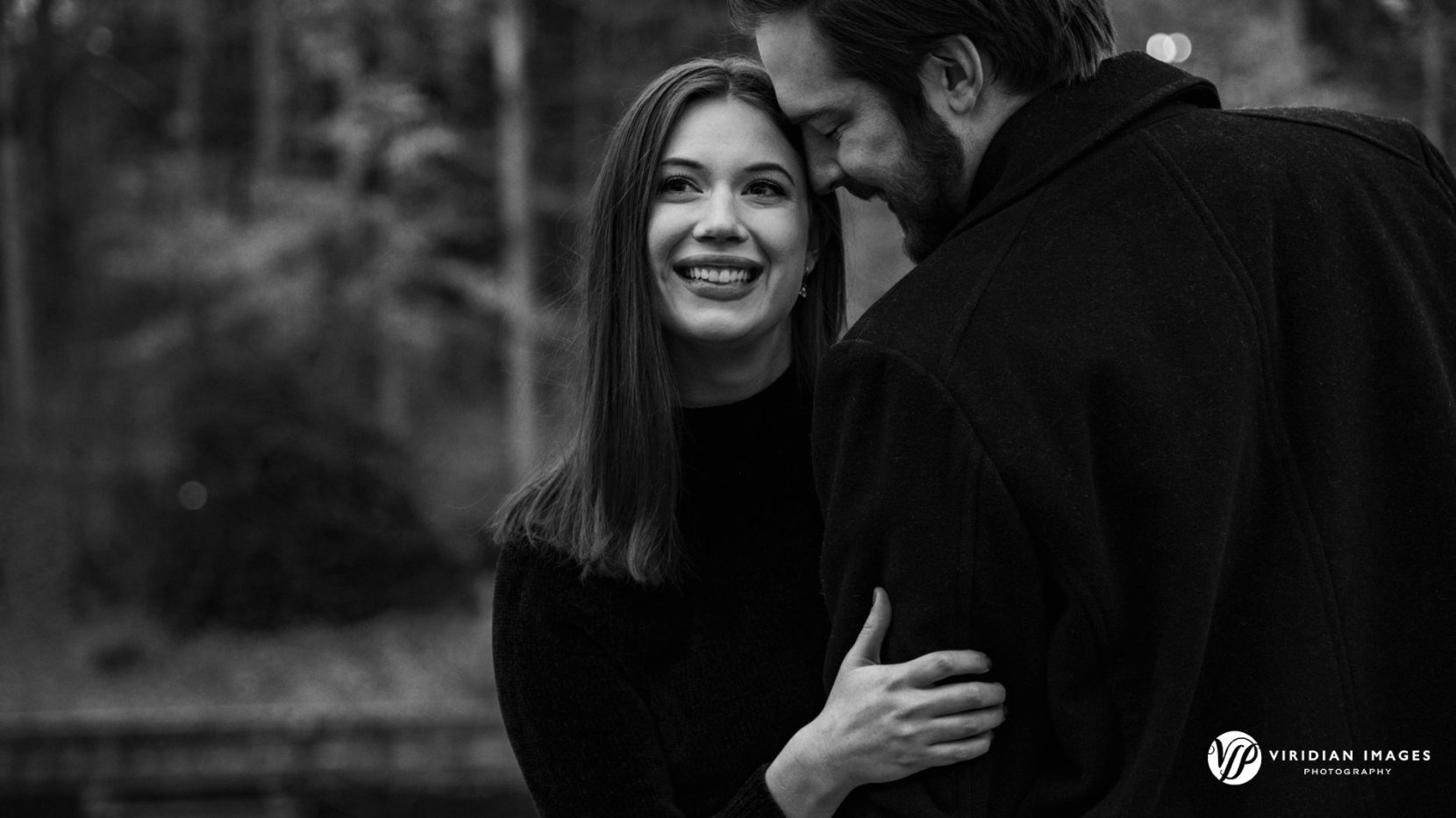 Close-up romantic portrait of Kelly and Kyle during their winter engagement session.