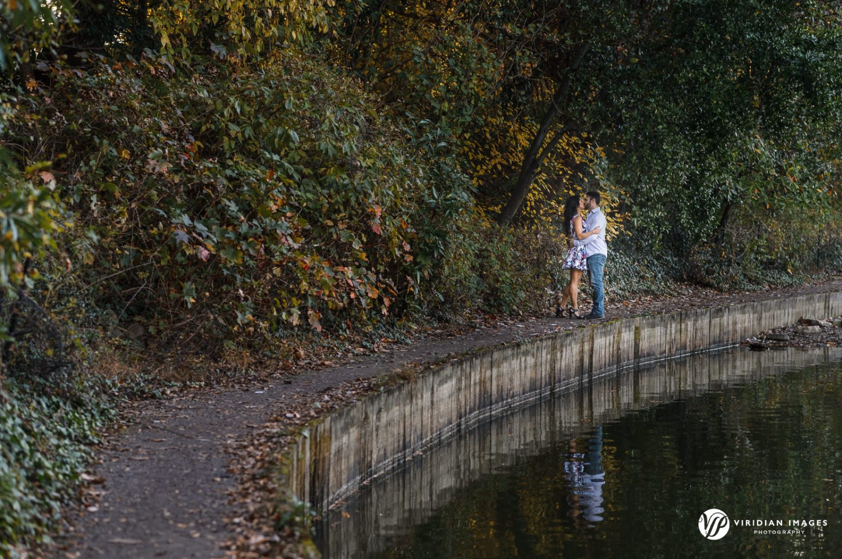 Fun playful moment between couple during fall engagement session at Piedmont Park