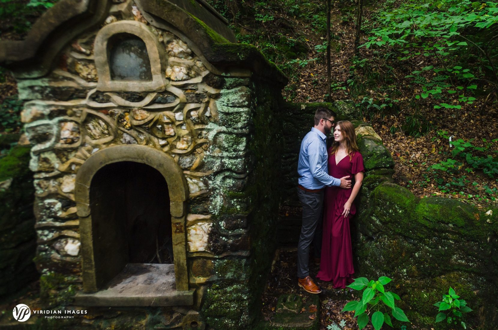 Bride-to-be wearing cranberry dress during Cascade Springs Natural Preserve engagement session