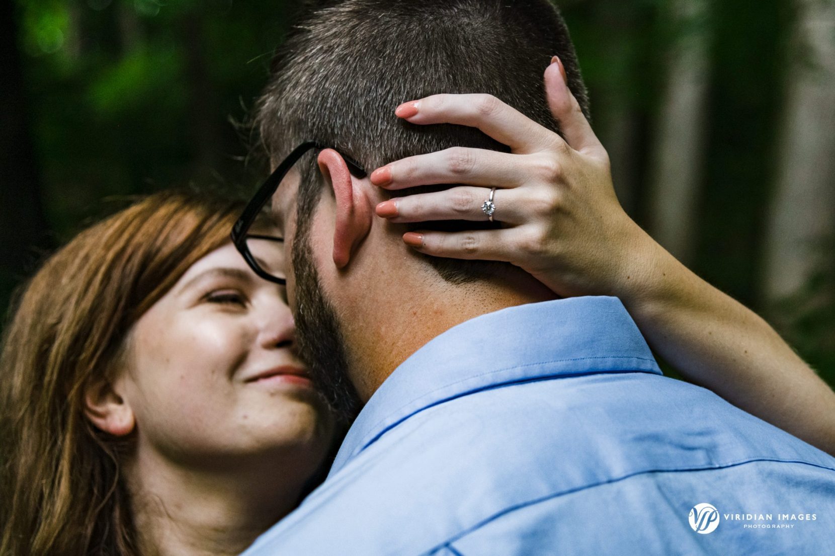 Romantic couple kiss and ring detail at Cascade Springs Nature Preserve in Atlanta