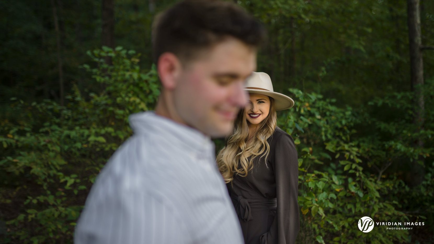 Creative and editorial style engagement portrait at Sweetwater Creek by Viridian Images Photography