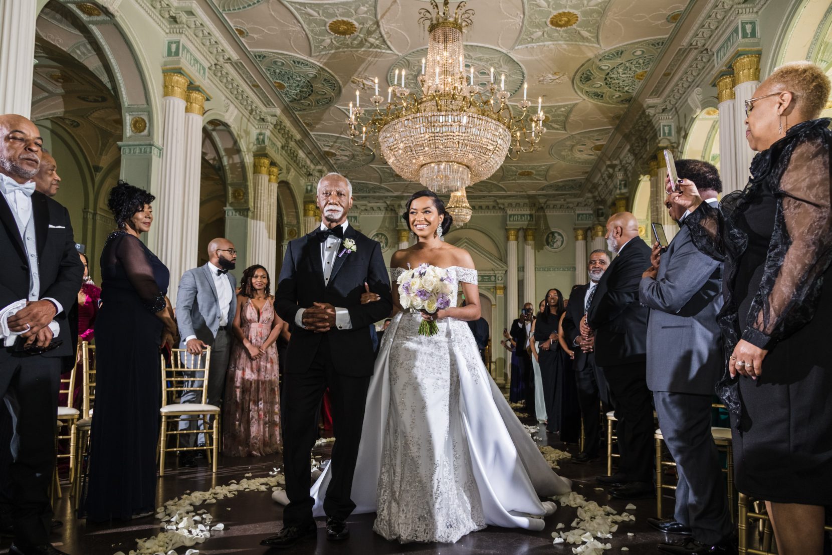 Close perspective of bride entering ceremony aisle at Biltmore Ballrooms