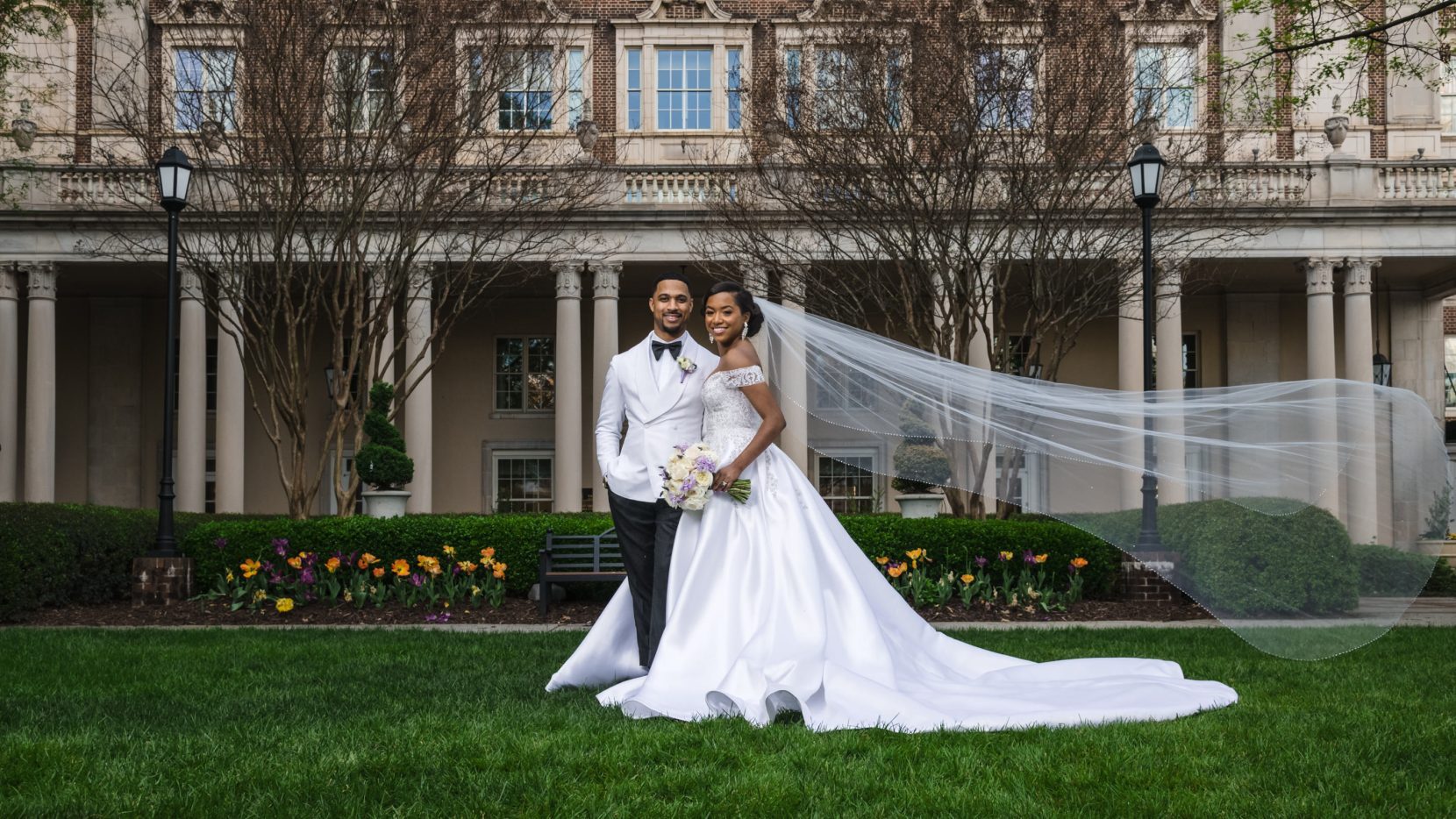 Elegant wedding portrait in front of columns at Biltmore Ballrooms Atlanta