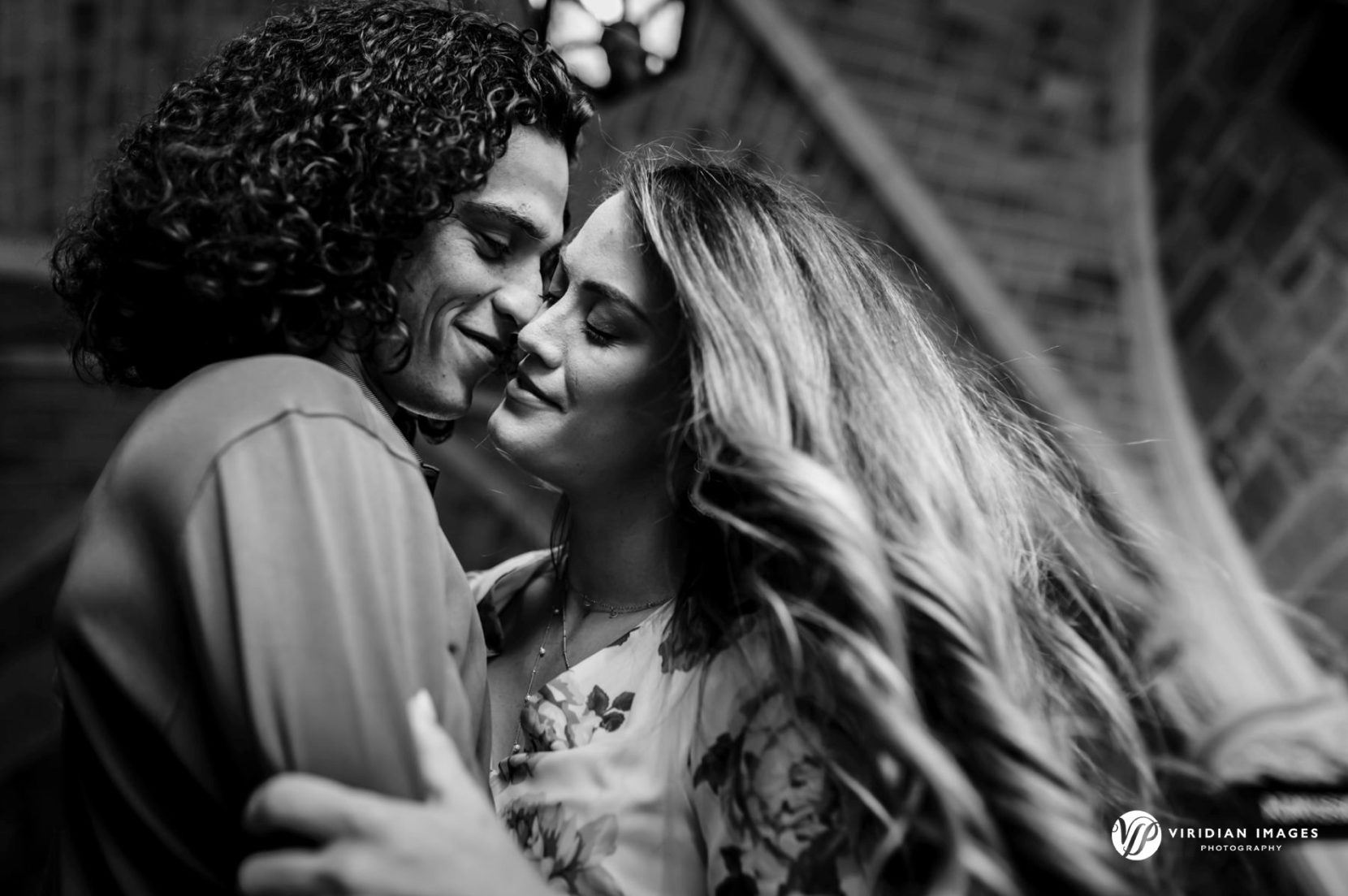 Romantic engagement photo under arch at Berry College Georgia