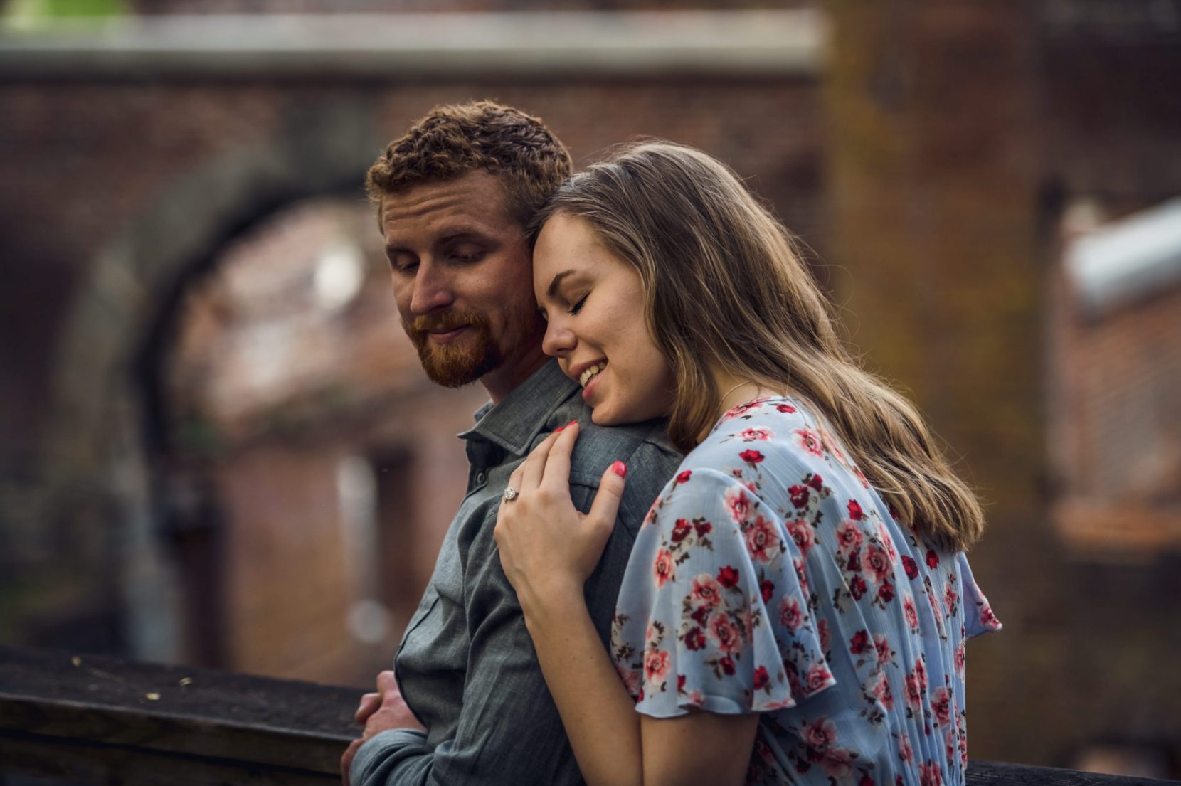Engaged couple relax in front of ruins at Sweetwater Creek State Park