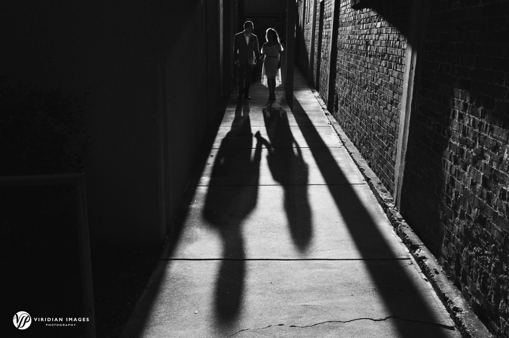 Creative and artistic silhouette of engaged couple in black and white
