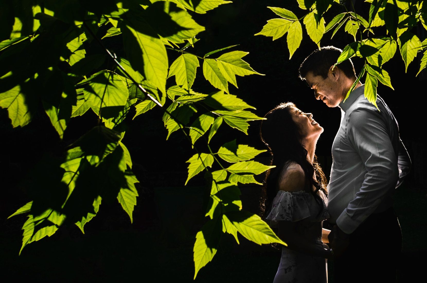 Romantic engagement portrait with harsh light at Piedmont Park