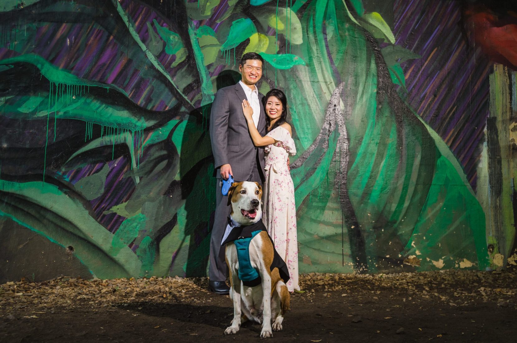Couple with their dog during engagement session at Piedmont Park in Atlanta