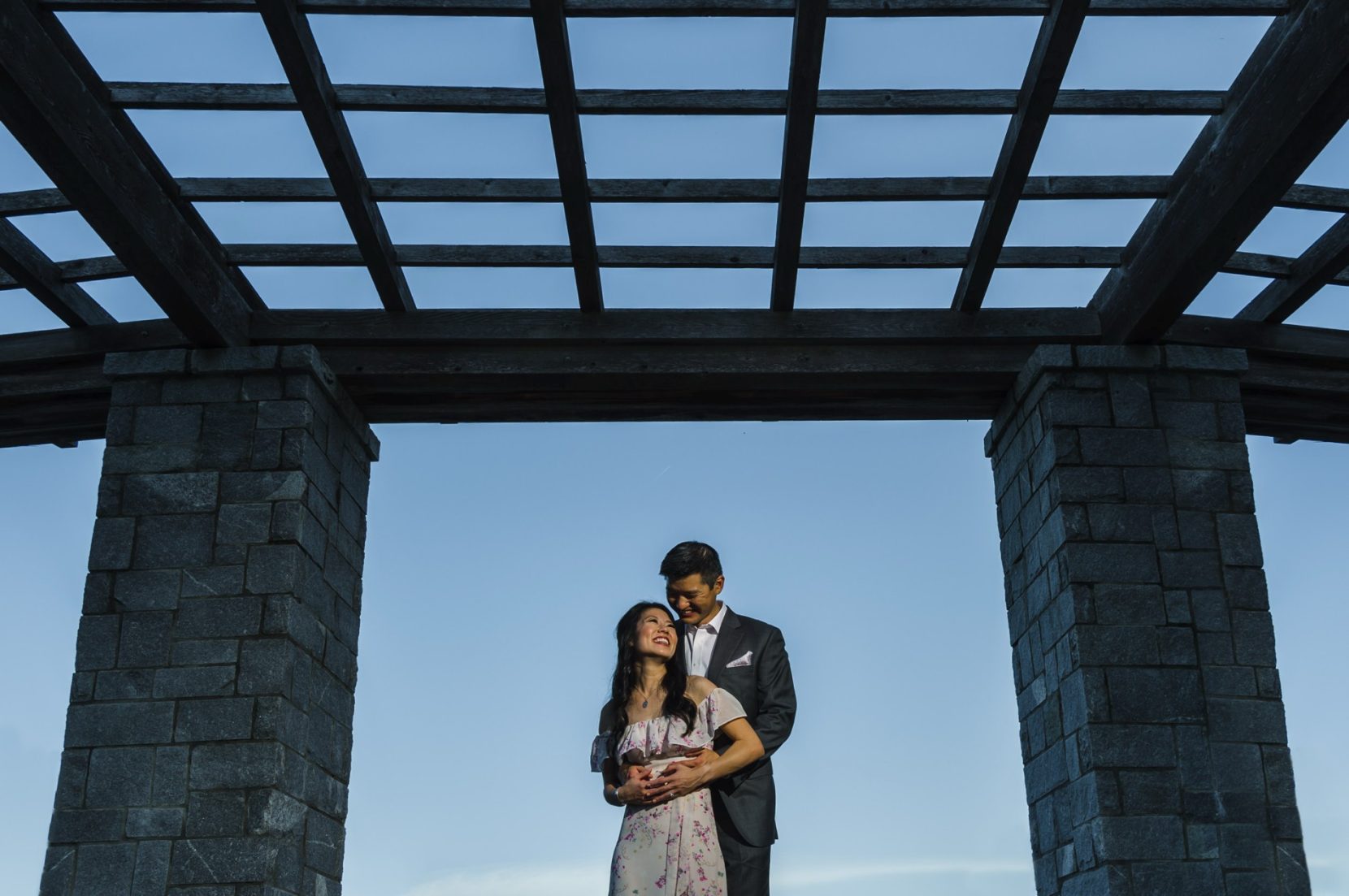 Piedmont Park engagement session portrait with open sky and trellis
