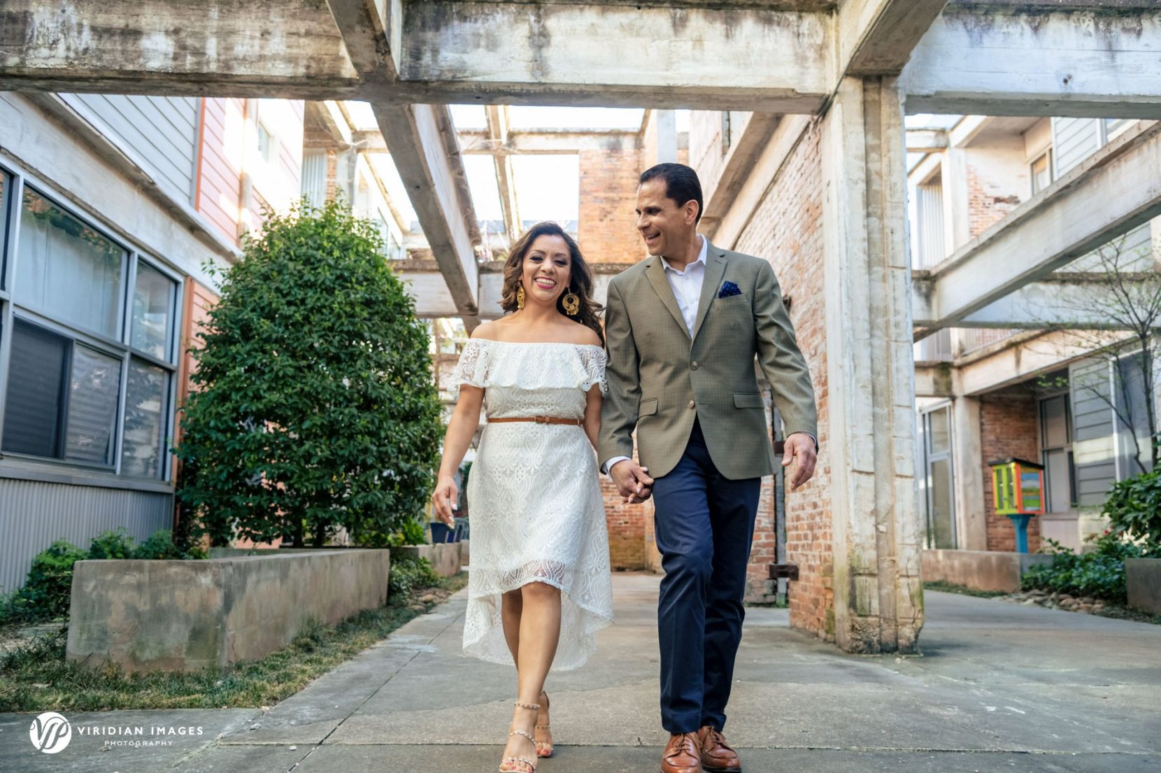Couple walking through StudioPlex during luxury Atlanta engagement session