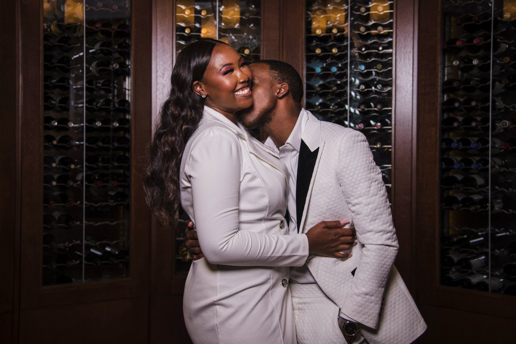 Couple enjoying a luxury engagement session inside a private Atlanta club