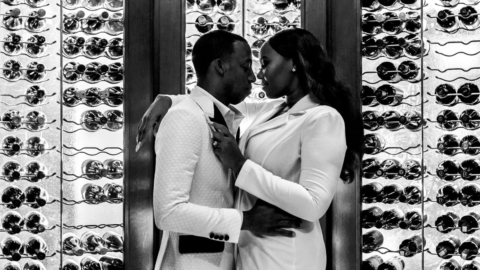 Cinematic engagement portrait created in the wine cellar