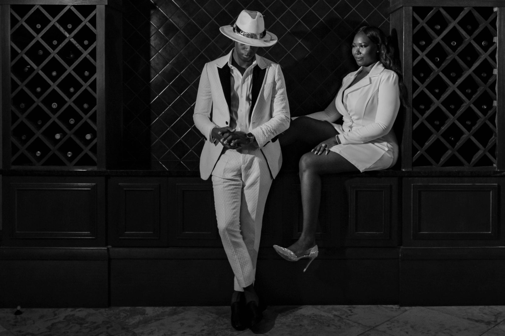 Black-and-white editorial engagement portrait inside the Commerce Club